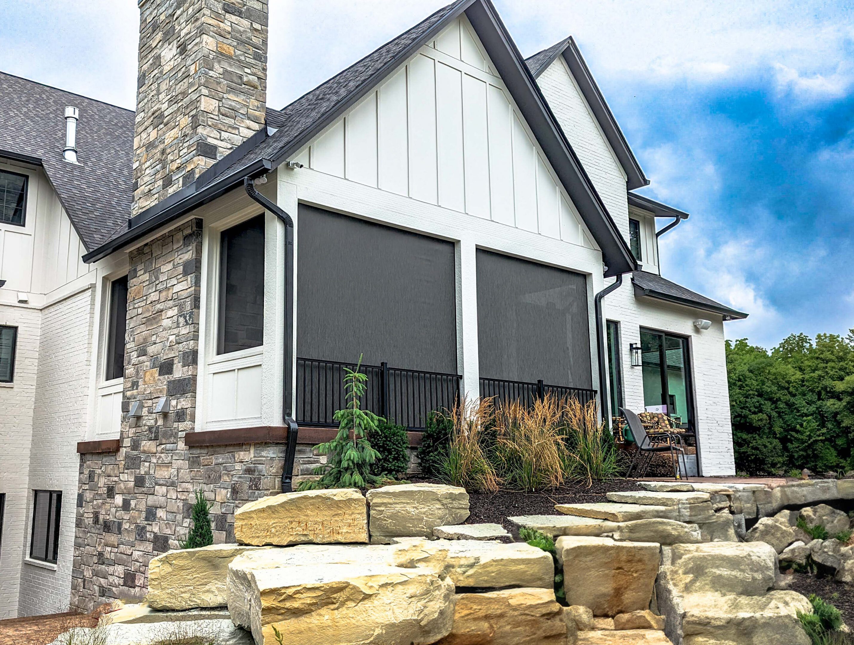 Modern house with screened porch and boulders